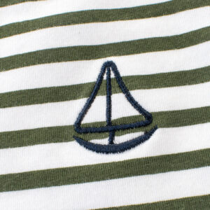 A cute child wearing a comfortable kids striped cotton t shirt for everyday summer play.