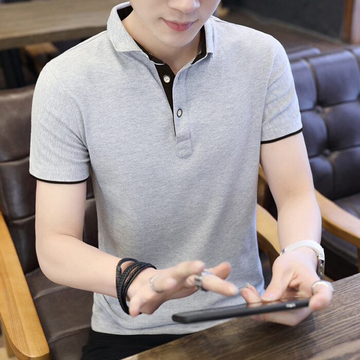 A stylish man wearing a classic mens short sleeve polo shirt for a smart-casual everyday look.