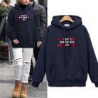Stylish young woman wearing a trendy womens oversized letter print hoodie for everyday casual wear.