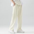 A stylish man wearing comfortable mens casual suit pants for a smart casual office look.