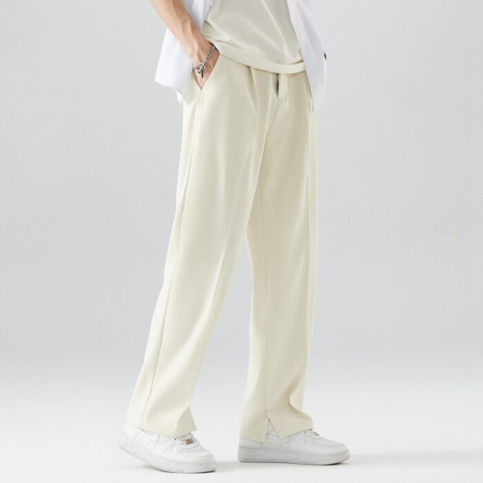9871b0da-59bd-4842-a2c8-e4e3fb26d26f.jpg A stylish man wearing comfortable mens casual suit pants for a smart casual office look.