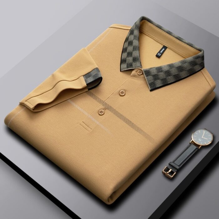 9b63cff7-d957-4847-a7a2-023c7b026da5.jpg A professional man wearing a classic mens cotton polo shirt ph for a smart casual office look.