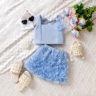 Cute little girl wearing a pink girls floral terno shorts with rose petal details.