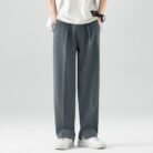 A stylish man wearing comfortable mens casual suit pants for a smart casual office look.