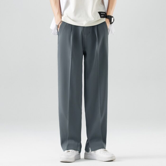 a6802572-fcd6-487a-906a-8b531b0fe75e.jpg A stylish man wearing comfortable mens casual suit pants for a smart casual office look.