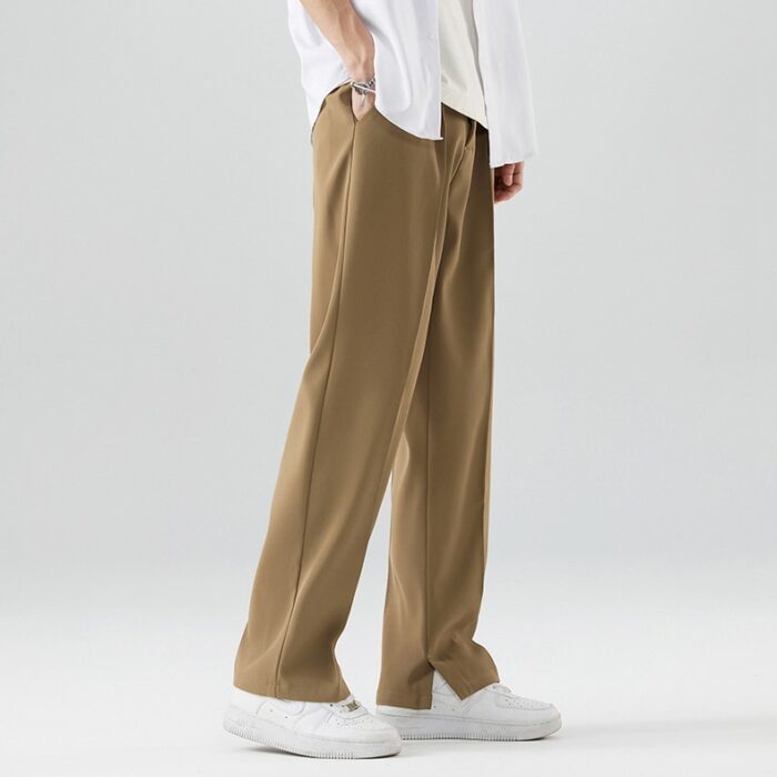 abbe55e2-5ec9-4bbe-8f46-d972ba2d8c84.jpg A stylish man wearing comfortable mens casual suit pants for a smart casual office look.