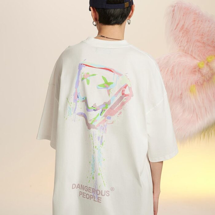 b0bdf77a-dfee-46c4-a8c3-31f5d6b4a309.jpg A stylish man wearing a trendy mens oversized graphic t shirt with a paint splatter design.
