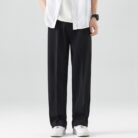 A stylish man wearing comfortable mens casual suit pants for a smart casual office look.