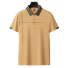 A professional man wearing a classic mens cotton polo shirt ph for a smart casual office look.