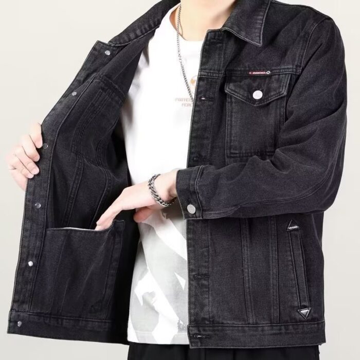 A stylish man wearing a versatile mens vintage distressed denim jacket for an edgy streetwear look.