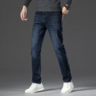 A stylish man wearing comfortable mens straight leg jeans ph for a business casual look.