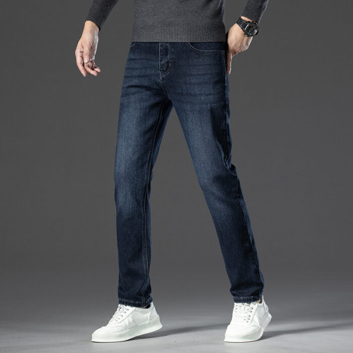 A stylish man wearing comfortable mens straight leg jeans ph for a business casual look.