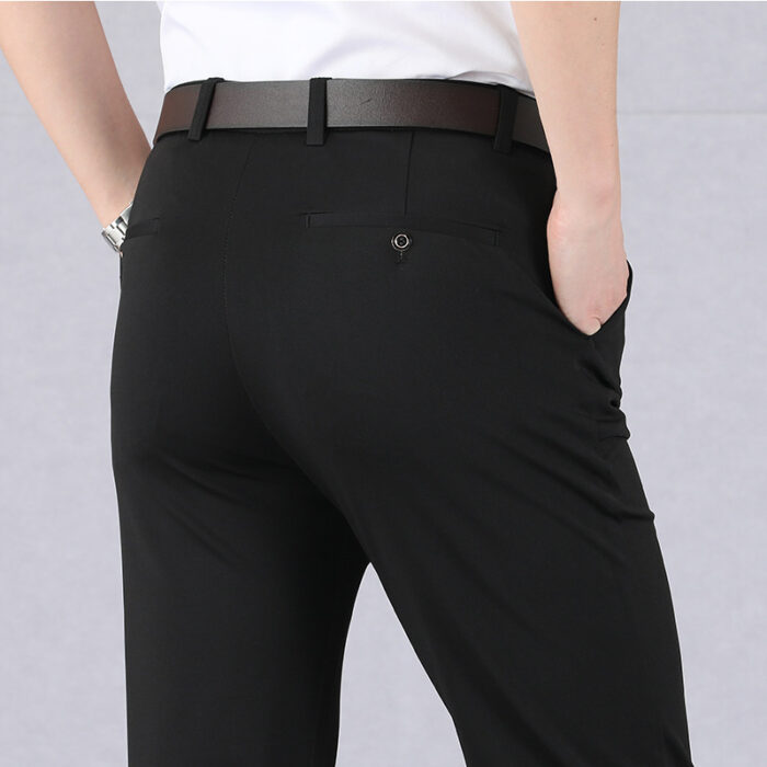 c078b27a-4586-4a7b-b0dd-8dd58c48de87.jpg A stylish man wearing perfectly tailored mens high waist trousers ph for a smart casual look.