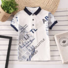 A handsome little boy wearing a breathable boys cotton polo shirt ph for a family weekend outing.