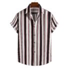 A stylish man wearing a classic mens short sleeve striped shirt for a casual summer look.