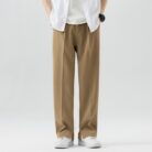 A stylish man wearing comfortable mens casual suit pants for a smart casual office look.