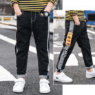 Stylish young boy wearing trendy boys straight leg jeans for everyday play.