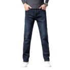 Handsome young man wearing comfortable mens straight leg jeans.