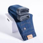 Handsome young man wearing comfortable mens straight leg jeans.