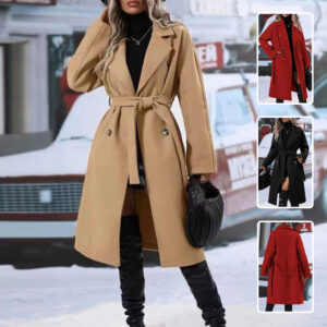 Stylish young woman wearing a beautiful womens long trench coat for winter travel.