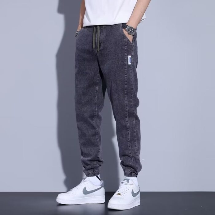 e152ab86-7c03-41ca-b808-a739a5ae4644.jpg Stylish young man wearing comfortable mens denim jogger pants.
