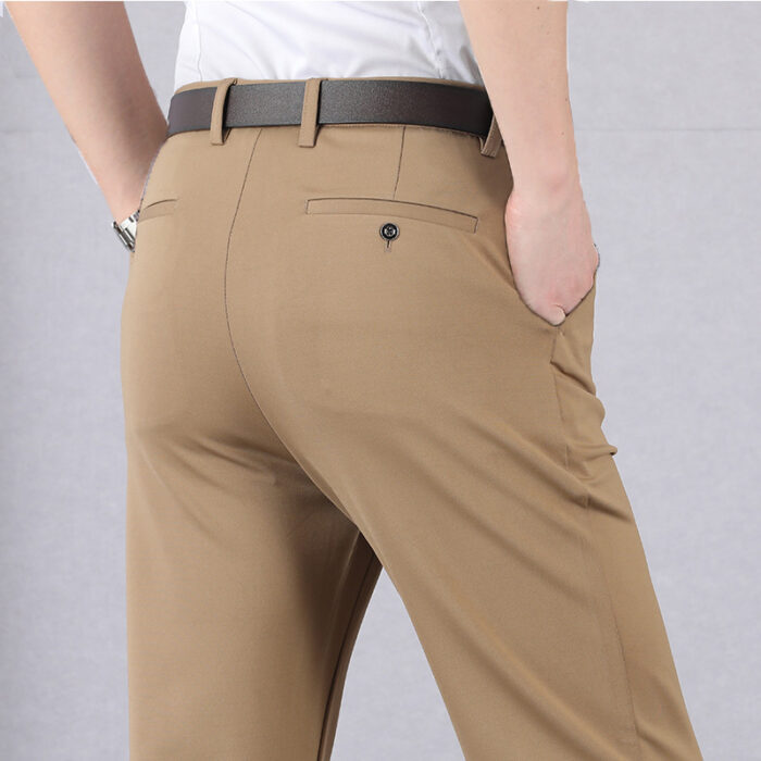 e391c41f-c172-43f4-8539-c85bc912c4c3.jpg A stylish man wearing perfectly tailored mens high waist trousers ph for a smart casual look.