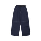 Close-up of the water-repellent nylon fabric and elastic drawstring on waterproof outdoor pants for kids.