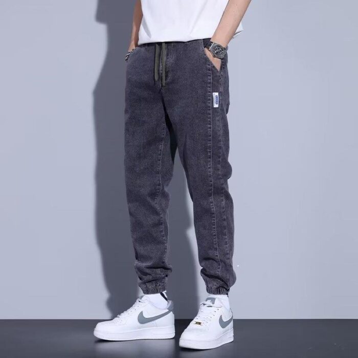 eb5efb87-7ba4-4f5e-ae14-bc25e8319bde.jpg Stylish young man wearing comfortable mens denim jogger pants.