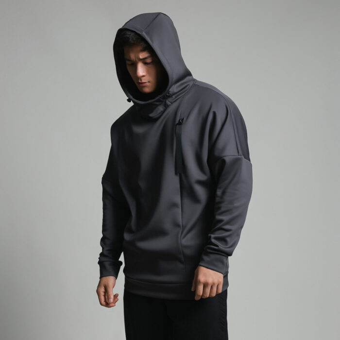 Stylish young man wearing a trendy mens loose high neck sweater.