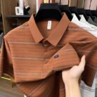 A stylish man wearing a comfortable mens striped polo shirt for a smart casual weekend look.