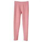 Stylish woman staying warm in thick womens thermal winter leggings for travel.