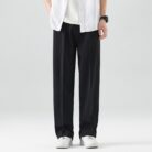 A stylish man wearing comfortable mens casual suit pants for a smart casual office look.