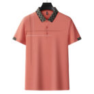 A professional man wearing a classic mens cotton polo shirt ph for a smart casual office look.