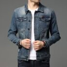 A stylish man wearing a trendy mens slim fit denim jacket for a sleek Korean streetwear look.