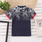 A handsome little boy wearing a breathable boys cotton polo shirt ph for a family weekend outing.