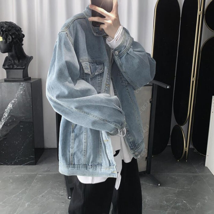 A stylish man wearing a versatile mens vintage wash denim jacket for an effortless streetwear look from K&K Trend Wear.