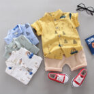 A happy child wearing a comfortable toddler boy cotton 2 piece outfit for everyday play from K&K Trend Wear.