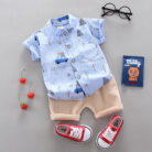 A happy child wearing a comfortable toddler boy cotton 2 piece outfit for everyday play from K&K Trend Wear.