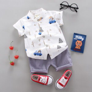A happy child wearing a comfortable toddler boy cotton 2 piece outfit for everyday play from K&K Trend Wear.