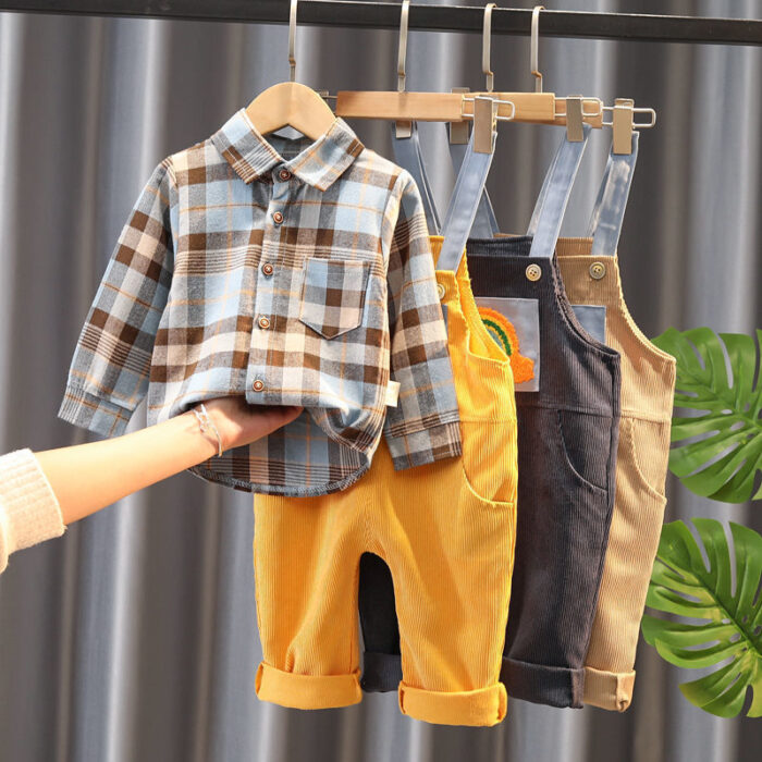 1621864997473.jpg A handsome little boy ready for a special occasion wearing a toddler boy formal suspender outfit from K&K Trend Wear.