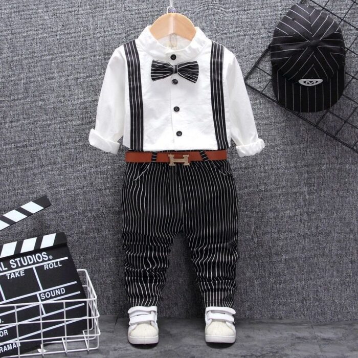 1621865003418.jpg A handsome little boy ready for a special occasion wearing a toddler boy formal suspender outfit from K&K Trend Wear.