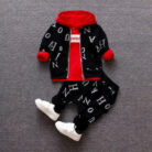 A happy child wearing a comfortable kids 2 piece long sleeve outfit for everyday play from K&K Trend Wear.