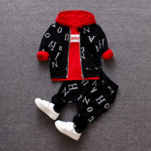 A happy child wearing a comfortable kids 2 piece long sleeve outfit for everyday play from K&K Trend Wear.