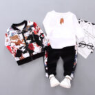 A happy little boy wearing a stylish toddler boy 3 piece outfit ready for a family party from K&K Trend Wear.