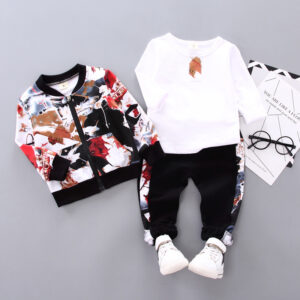 A happy little boy wearing a stylish toddler boy 3 piece outfit ready for a family party from K&K Trend Wear.