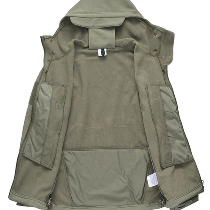 A man exploring the outdoors wearing a durable mens waterproof softshell jacket for maximum weather protection from K&K Trend Wear.