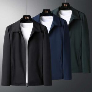 A stylish man wearing a versatile mens smart casual collared jacket for a sharp office look from K&K Trend Wear.