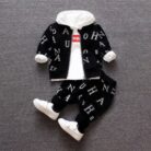 A happy child wearing a comfortable kids 2 piece long sleeve outfit for everyday play from K&K Trend Wear.