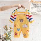 An adorable little boy ready for a party wearing a toddler boy overalls and shirt set from K&K trend Wear.
