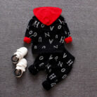 A happy child wearing a comfortable kids 2 piece long sleeve outfit for everyday play from K&K Trend Wear.